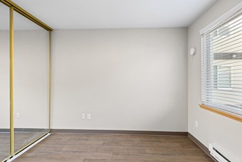Bedroom with sliding mirror